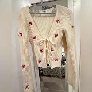 Cream V-Neck Sweater with Red Floral Details